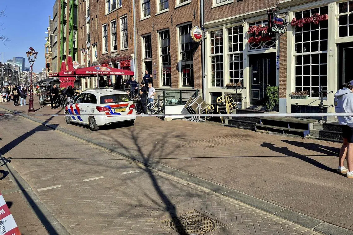 Police cordon the area where five people were wounded during a stabbing attack in Amsterdam on March 27.