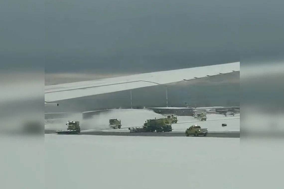 A screenshot from a video posted online shows vehicles trying to clear snow at Vancouver's international airport.