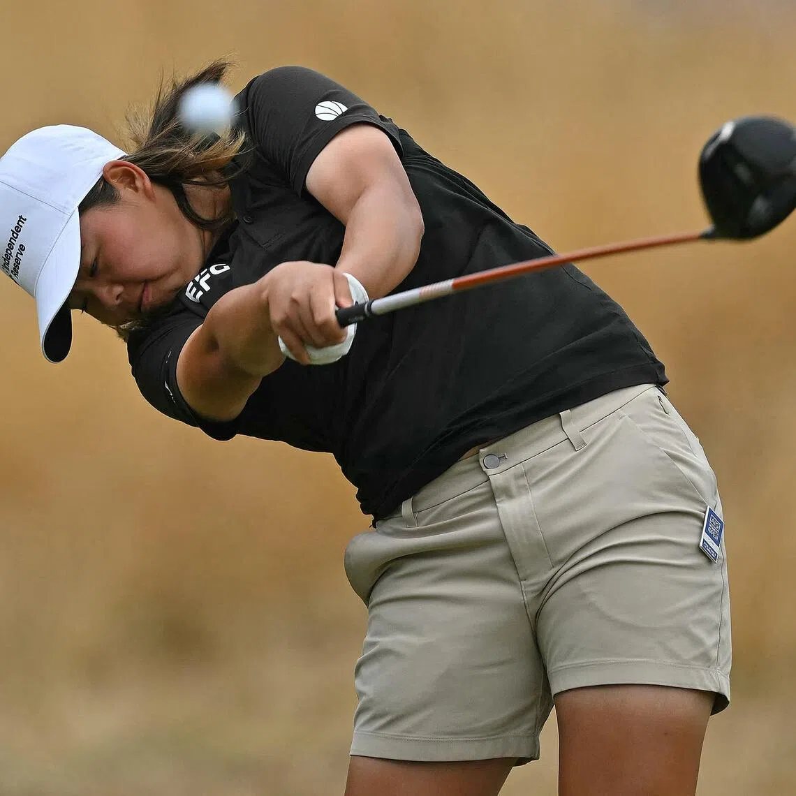 Singapore's Shannon Tan drives from the 3rd tee on the final day of the 2026 Women's British Open Golf Championships at Royal Lytham & St. Annes Golf Club, north-west England, on August 2, 2026. (Photo by Glyn KIRK / AFP) / RESTRICTED TO EDITORIAL USE