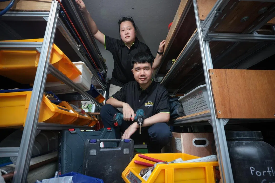 Plumbers Geraldine Goh and Yeo Kai Xun pictured with their plumbing equipment and tools in their van.