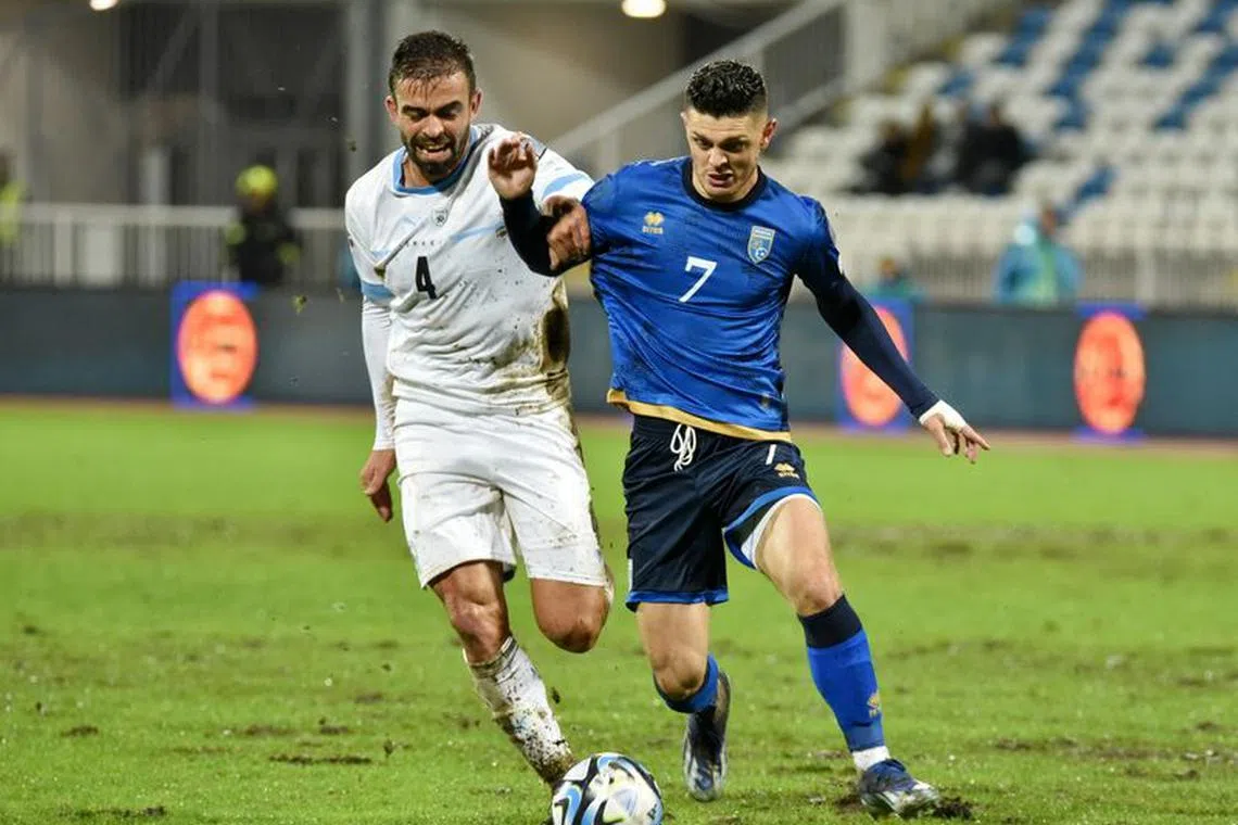 Soccer Football - UEFA Euro 2024 Qualifier - Group I - Kosovo v Israel - Fadil Vokrri Stadium, Pristina, Kosovo - November 12, 2023 Kosovo's Milot Rashica in action with Israel's Miguel Vitor REUTERS/Laura Hasani