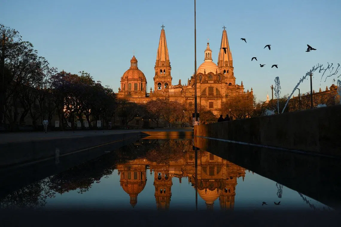 Birds flying near the cathedral days after a wave of blockades and attacks by organized crime triggered by a Mexican military operation in which Jalisco New Generation Cartel leader Nemesio Oseguera, known as "El Mencho," was killed, in Guadalajara, Mexico, on Feb 25, 2026. 