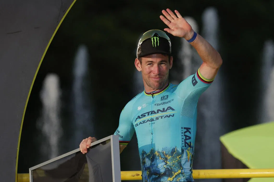 FILE PHOTO: Cycling - Tour de France - Stage 21 - Monaco to Nice - Monaco, France - July 21, 2024 Astana Qazaqstan Team's Mark Cavendish celebrates on the podium as he is presented with a jersey for his record 35th stage wins at the Tour de France REUTERS/Stephane Mahe
