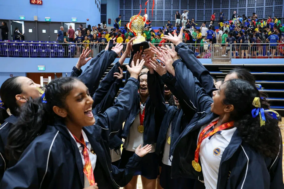 Methodist Girls' School players celebrating their win against CHIJ Secondary in the C Division netball final on Aug 29.