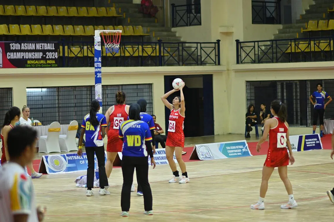 Singapore goal-attack Amandeep Kaur Chahal attempting a shot in the Republic's semi-final win over Malaysia at the Asian Netball Championship on Oct 26, 2024.