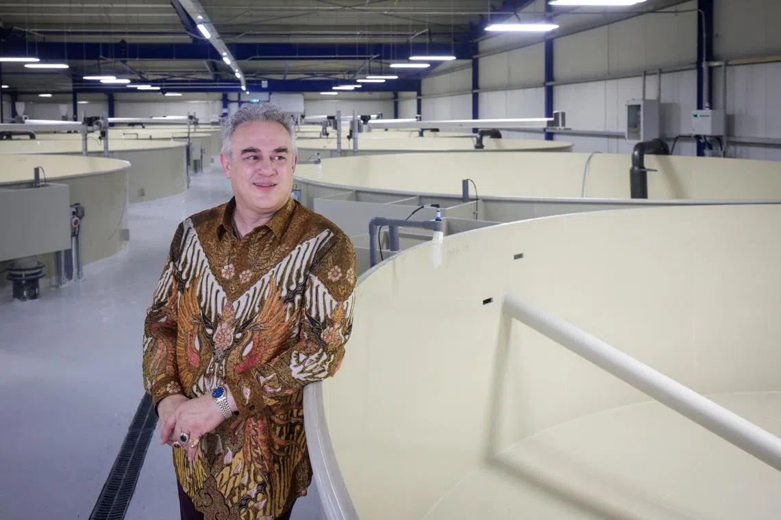 Founder Farshad Shishehchian at Blue Aqua’s indoor rainbow trout farm facility on June 4.