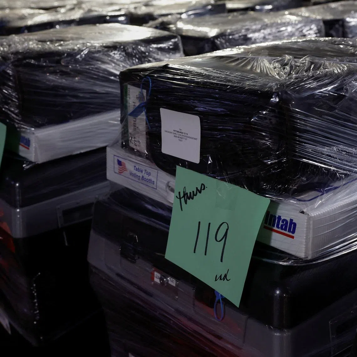 FILE PHOTO: Wrapped voting machines wait for delivery inside the Allegheny County Elections Warehouse in Pittsburgh, Pennsylvania, U.S., October 30, 2024. REUTERS/Shannon Stapleton/File Photo