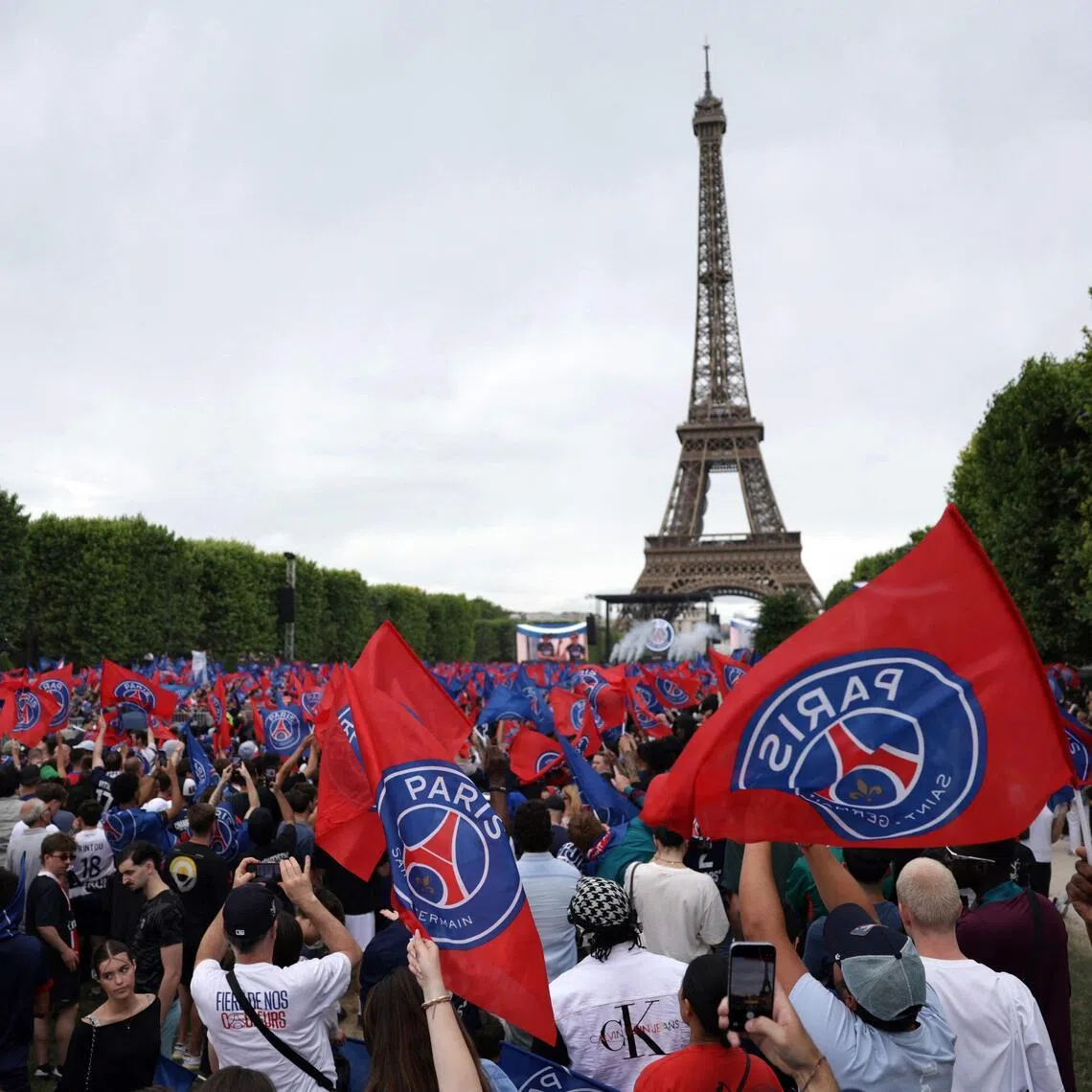 Paris Saint-Germain supporters gathering on the Champs-de-Mars during a special event organised in Paris on May 31, 2026 to celebrate PSG's victory over Arsenal during the Champions League final on May 30.