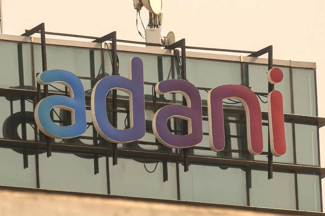 epa11735743 The logo of Adani Group atop a building in Mumbai, India, 23 November 2024. On 20 November 2024, The U.S. Securities and Exchange Commission (SEC) charged Adani Green Energy Ltd. executives Gautam Adani and Sagar Adani and Azure Power Global Ltd. executive Cyril Cabanes with participating in a bribery scheme designed to benefit the two renewable energy companies from a multi-billion dollar solar energy project awarded to them by the Indian government.  EPA-EFE/DIVYAKANT SOLANKI