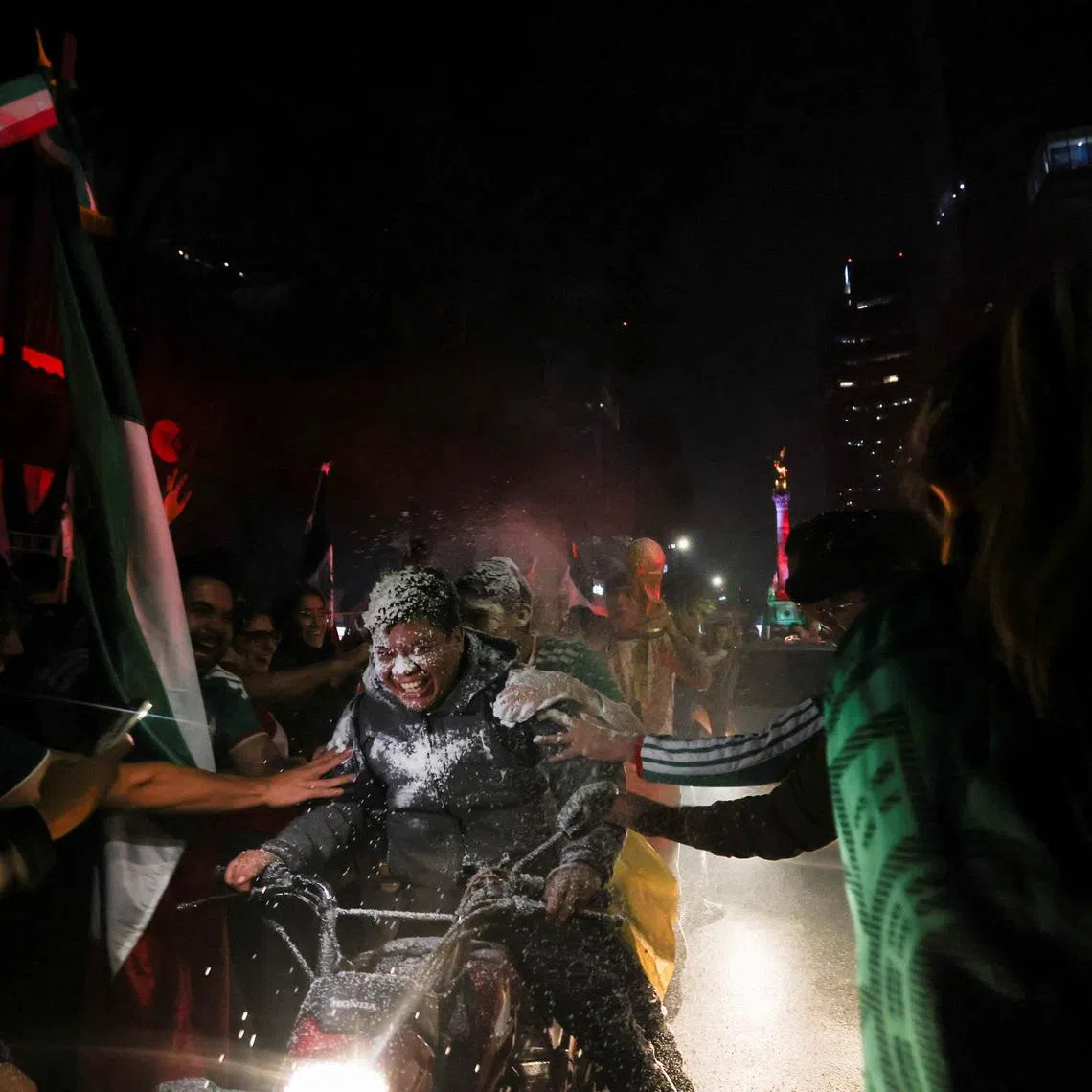 Fans celebrate after Mexico beat South Korea to reach the World Cup's knockout stage.