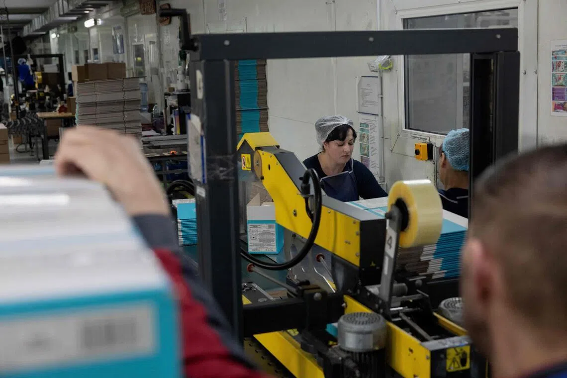 Employees at households goods producer Biosphere work at a factory in Dnipro on April 21. 