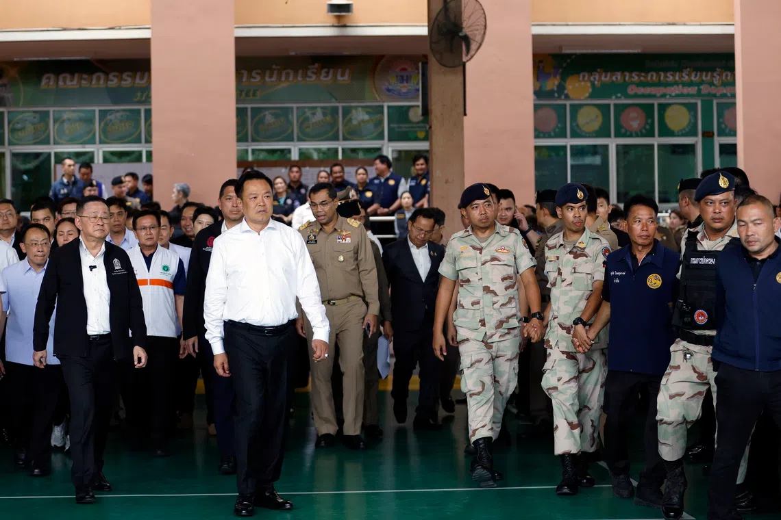 Thailand Prime Minister Anutin Charnvirakul (in white) and Minister of Education Prasert Jantararuangtong (left) inspect the site following a school shooting at Debsirin Nonthaburi School in Bang Kruai district, Nonthaburi province, Thailand on Aug 7.