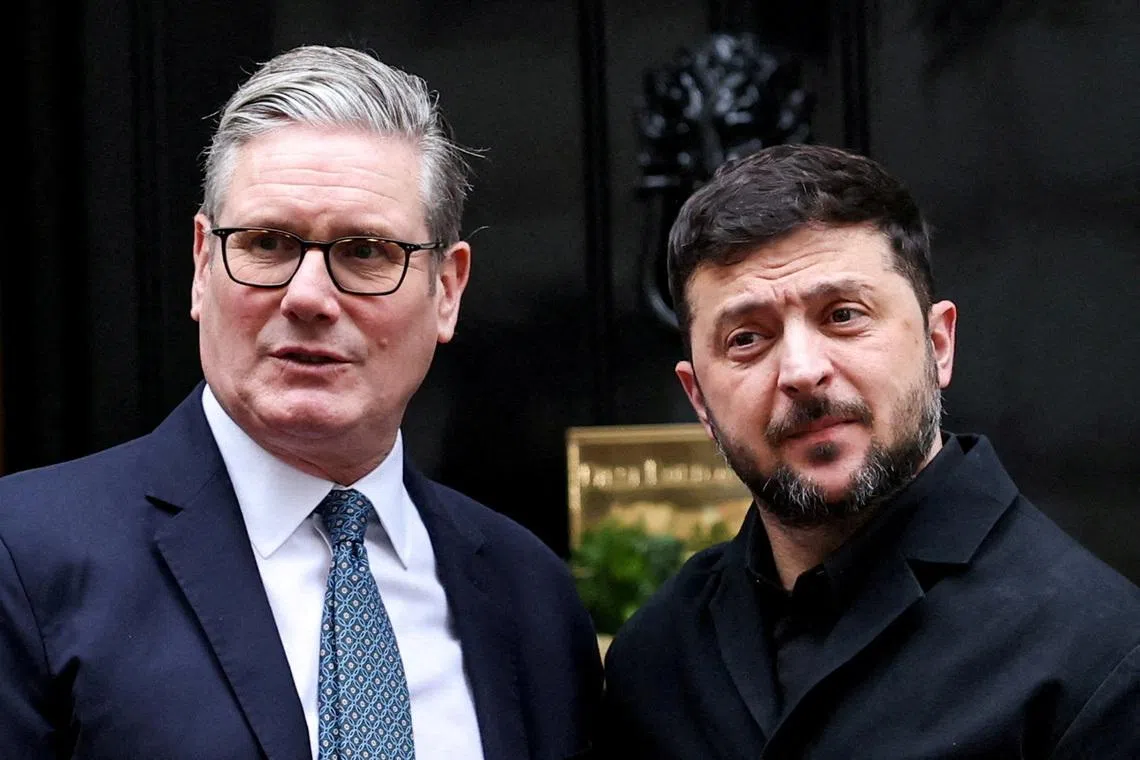 British Prime Minister Keir Starmer greets Ukrainian President Volodymyr Zelenskiy at 10 Downing Street,, December 8, 2025. REUTERS/Isabel Infantes