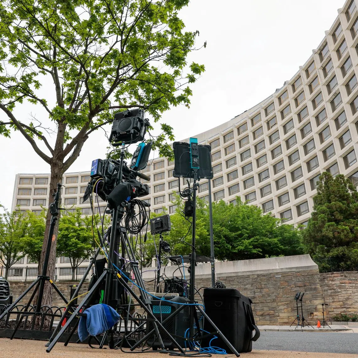 Media broadcasting equipment is placed on a sidewalk near the Washington Hilton hotel, where a shooting incident occurred yesterday night at the annual White House Correspondents' Association dinner, in Washington, D.C., U.S., April 26, 2026. REUTERS/Kylie Cooper