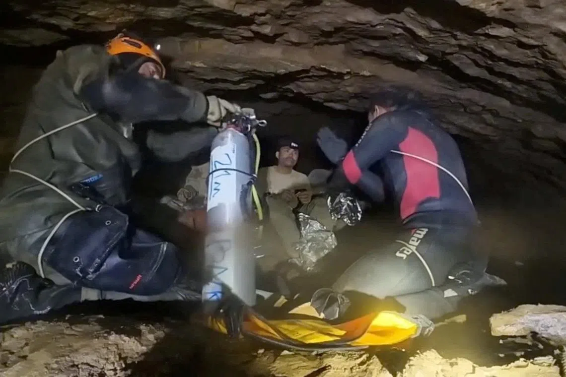 The search for the last two on May 31 was focused on a tight, inundated passage believed to lie beyond the area where the five survivors were found.