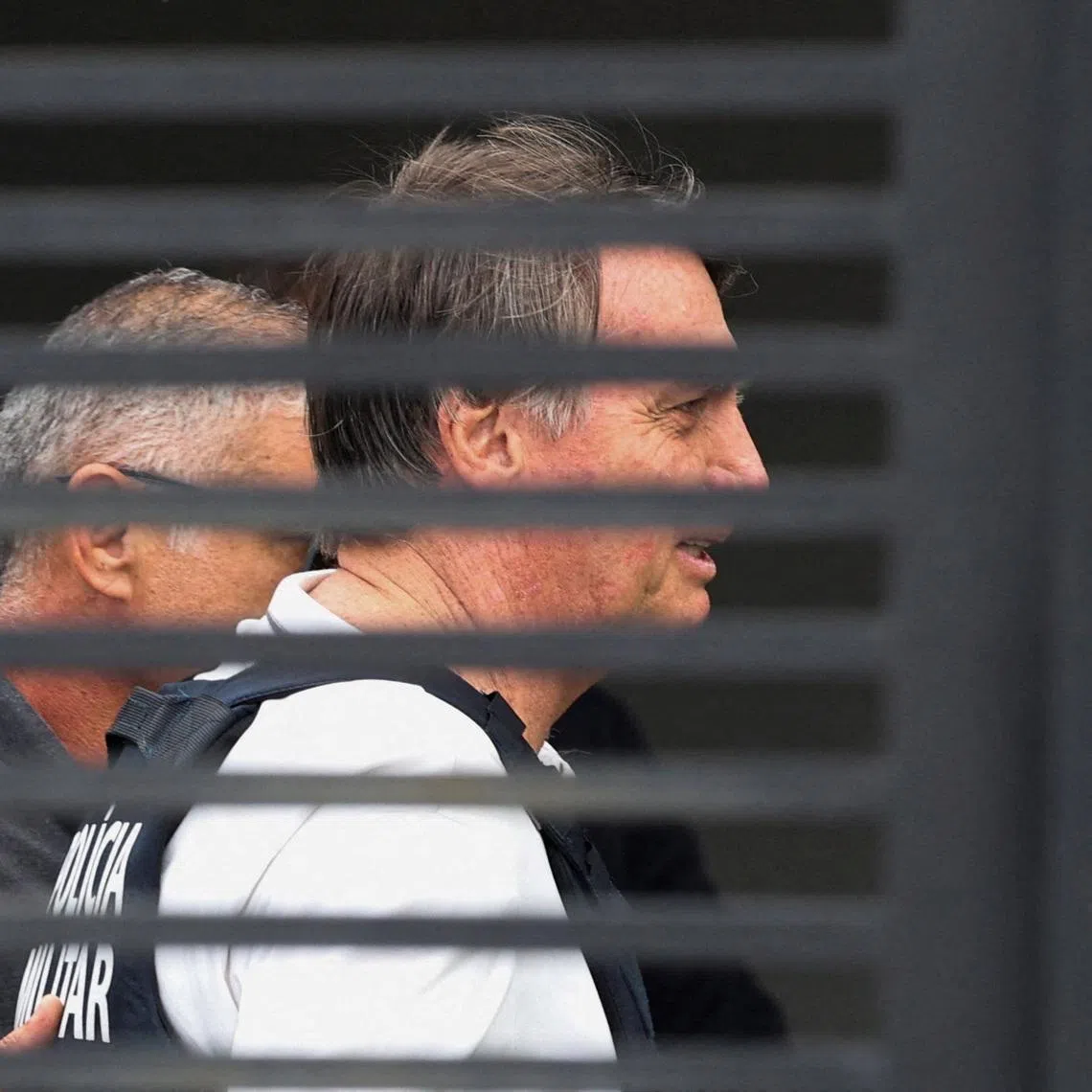 Former Brazilian president Jair Bolsonaro arrives home to begin serving house arrest, under an initial 90-day regime authorised on medical grounds, in Brasilia on March 27.