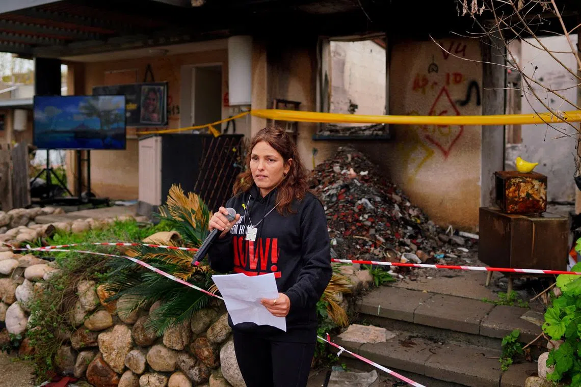 FILE PHOTO: Released hostage Amit Soussana, kidnapped on the deadly October 7 attack by Palestinian Islamist group Hamas, talks to the press in front of her destroyed home at the Kibbutz Kfar Aza, Israel, January 29, 2024. REUTERS/Alexandre Meneghini/File Photo