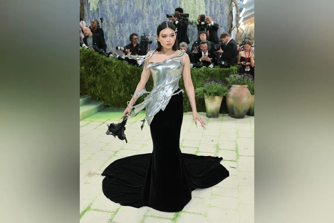Grace Ling wore an aluminium breastplate by her namesake label and custom shoes by Singaporean footwear brand Charles & Keith. 