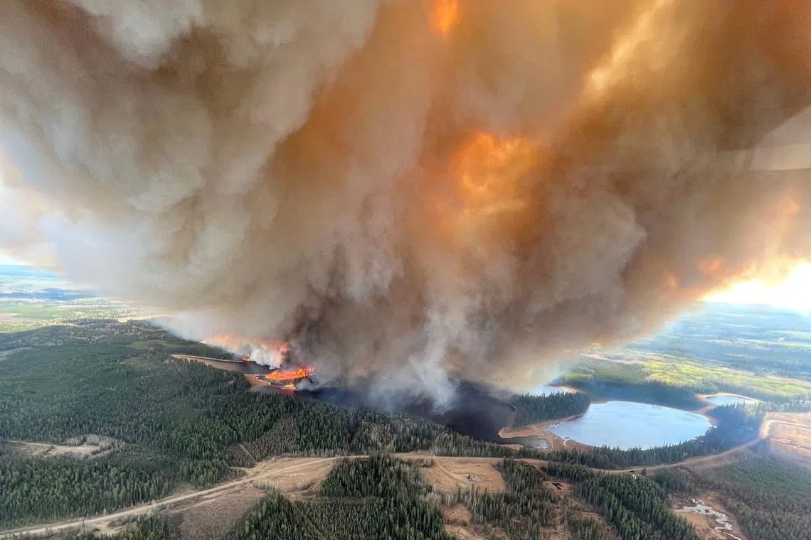 A rapid onset of unseasonably high temperatures is causing both fires and flooding in western Canada.