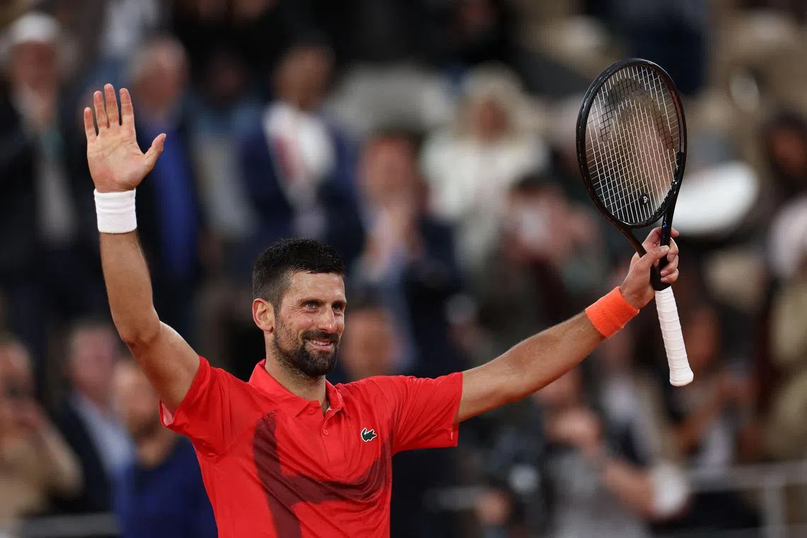 Serbia's Novak Djokovic celebrates after winning his first-round match against Mackenzie Mcdonald of the US.