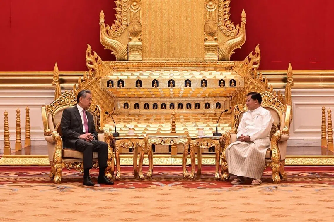 China’s Foreign Minister Wang Yi (left) speaking with Myanmar President Min Aung Hlaing during a meeting at the presidential house in Naypyitaw, Myanmar, on April 25.