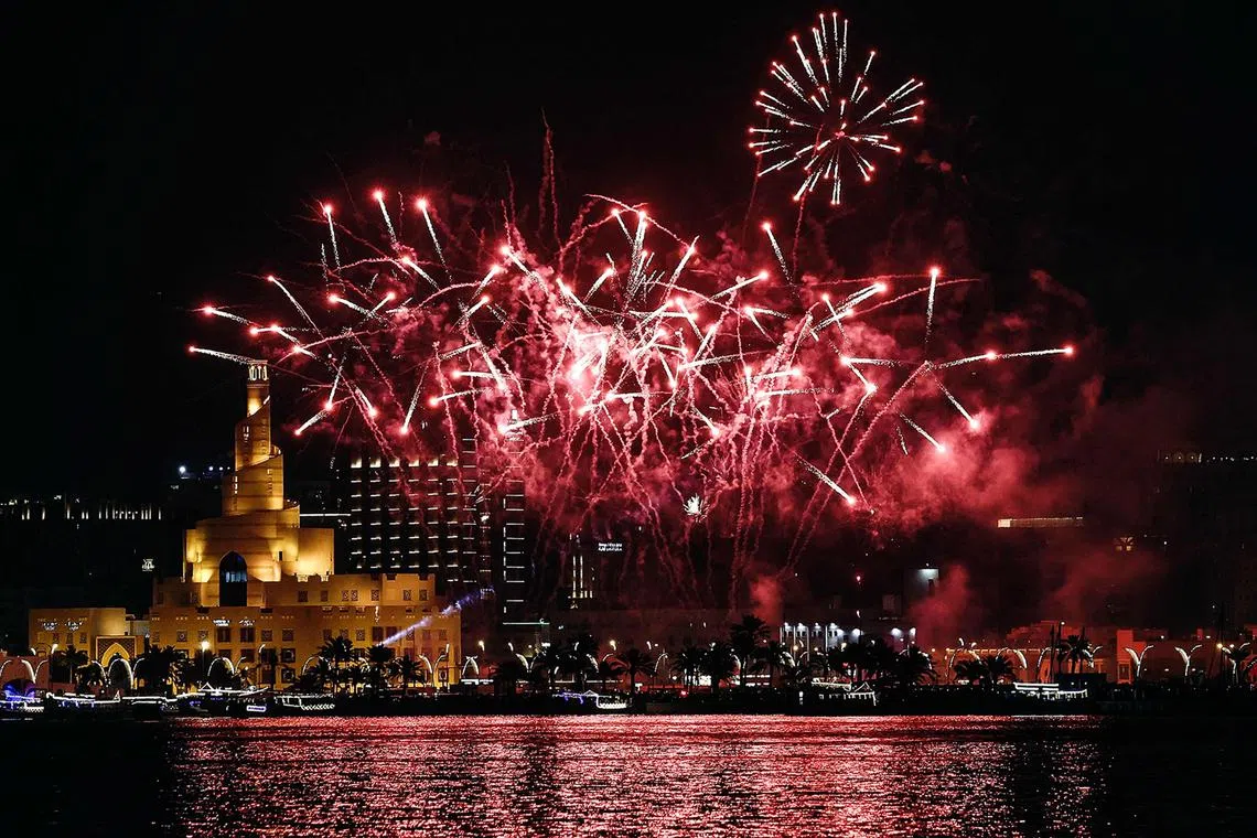 Fireworks lighting up the sky over the Fanar Mosque  during celebrations to mark the first day of the Muslim holiday of Eid al-Fitr, and the end of the holy month of Ramadan, on April 10, 2024. 