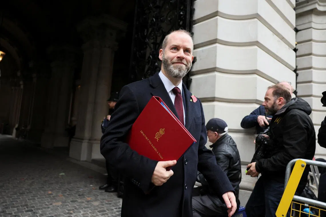 FILE PHOTO: Britain's Secretary of State for Business and Trade Jonathan Reynolds walks on Downing Street on the day of the budget announcement, in London, Britain October 30, 2024. REUTERS/Isabel Infantes/File Photo