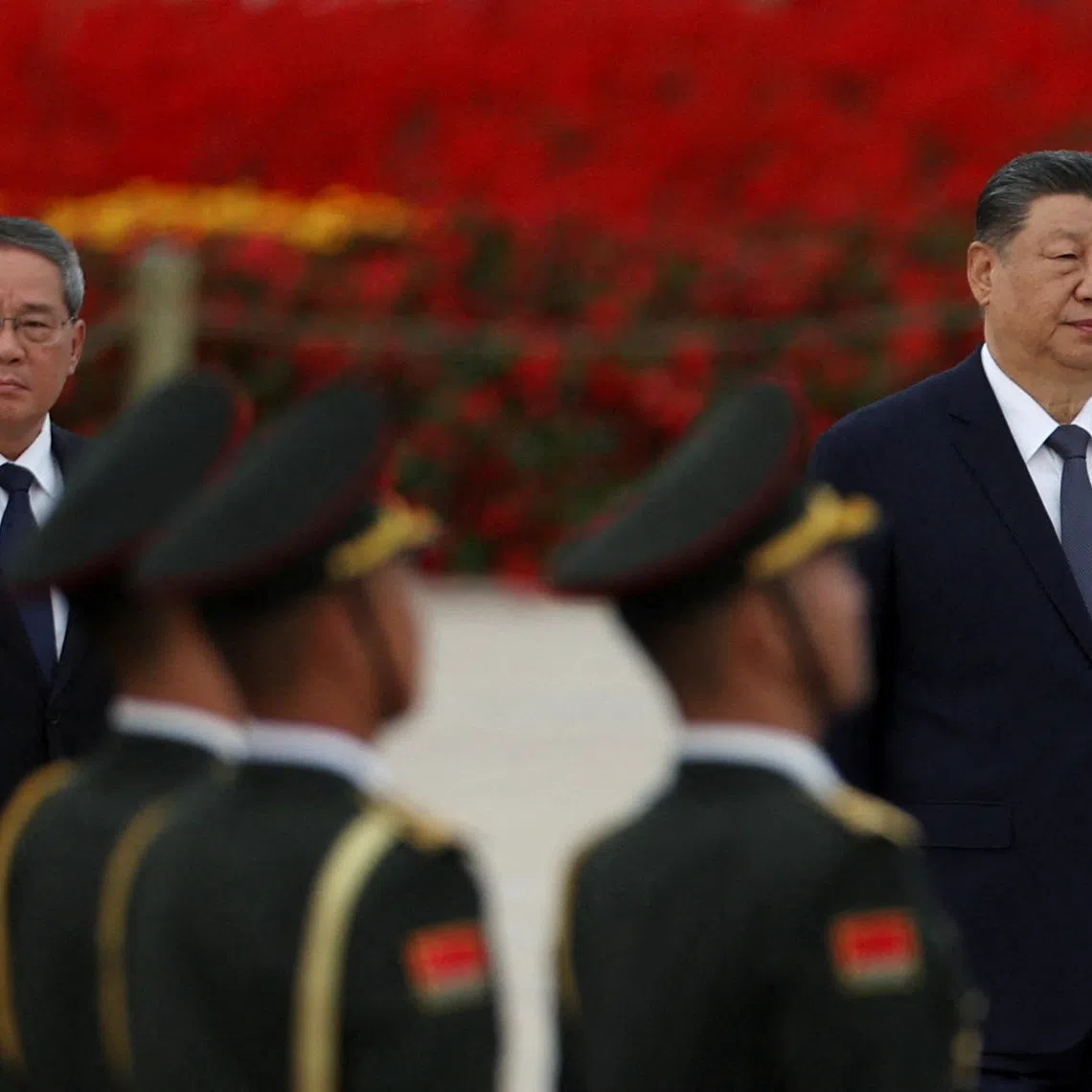 Chinese President Xi Jinping and Premier Li Qiang arrive for a ceremony to mark Martyrs' Day, a day ahead of the Chinese National Day, on Tiananmen Square in Beijing, China September 30, 2026. REUTERS/Florence Lo