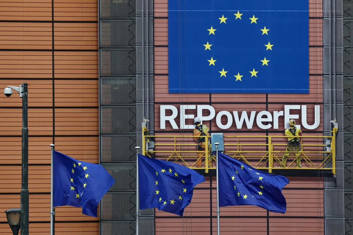 FILE PHOTO: European Union flags flutter outside the EU Commission headquarters in Brussels, Belgium, April 12, 2022. REUTERS/Yves Herman/File Photo