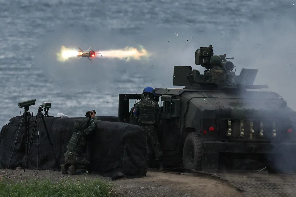 A US-made TOW-2A wire-guided anti-tank missile is launched by Taiwanese soldiers from a M1167 TOW carrier vehicle at the Fangshan training grounds in Pingtung, Taiwan, August 26, 2024. REUTERS/Ann Wang/File Photo