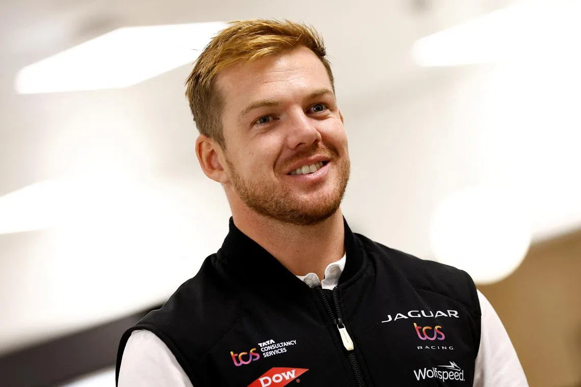 FILE PHOTO: Nick Cassidy, Formula E racing driver for the Jaguar TCS Racing team, talks to media at the new technical headquarters of Jaguar TCS Racing in Kidlington, Britain, November 30, 2023.  REUTERS/Peter Cziborra/File Photo