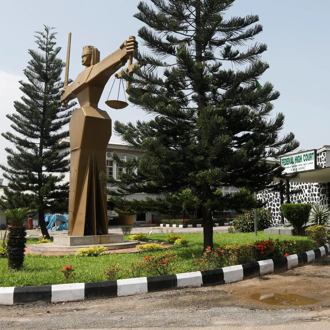 People stand outside the Federal High Court in Lagos, Nigeria October 27, 2020. REUTERS/Temilade Adelaja