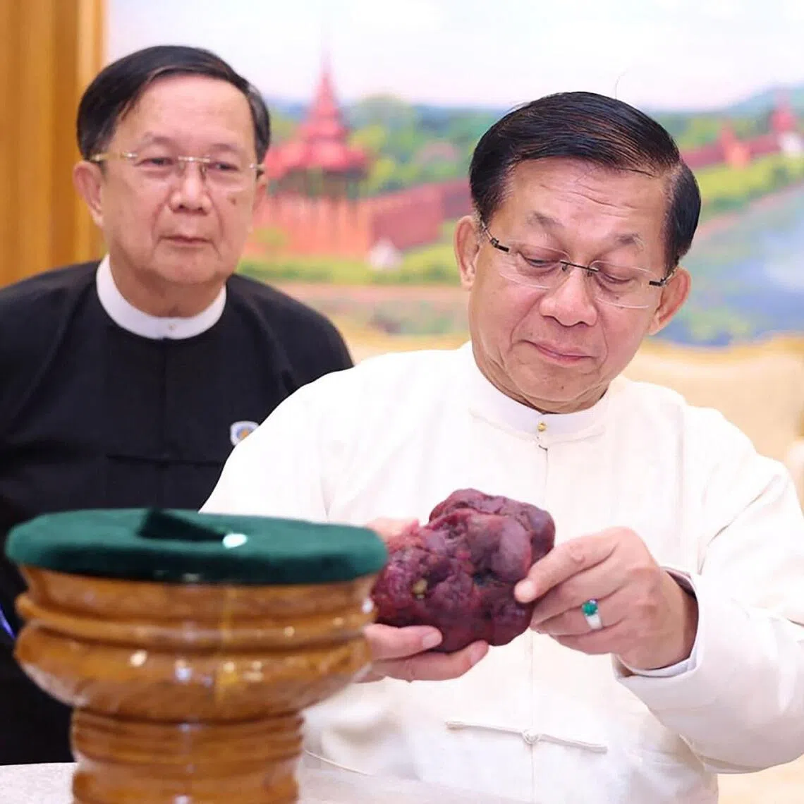 Myanmar’s coup leader turned president Min Aung Hlaing holding an 11,000-carat ruby in Naypyitaw, after it was found at a gem tract in Mogok in Mandalay. 