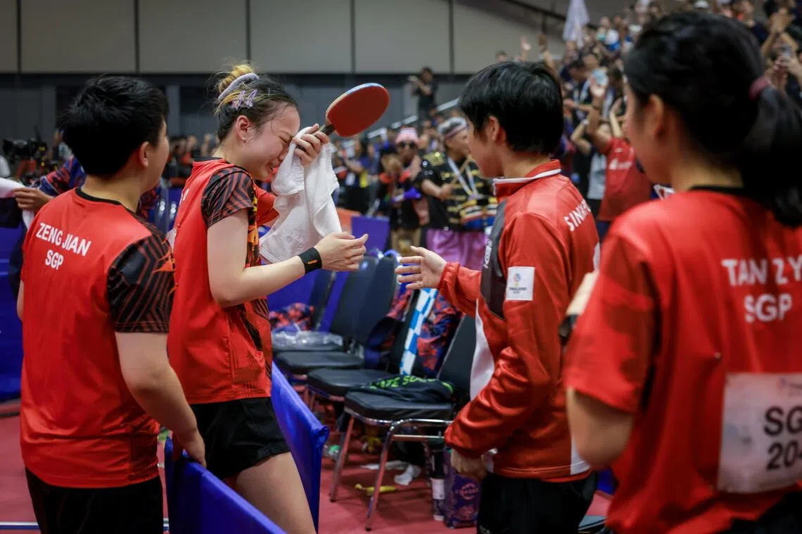 Singapore’s Ser Lin Qian is in tears after losing 3-2 to Thailand’s Suthasini Sawettabut in the table tennis women’s team final at Central Westgate in Bangkok on Dec 14. Singapore settled for silver after losing 3-2 to the Thais.