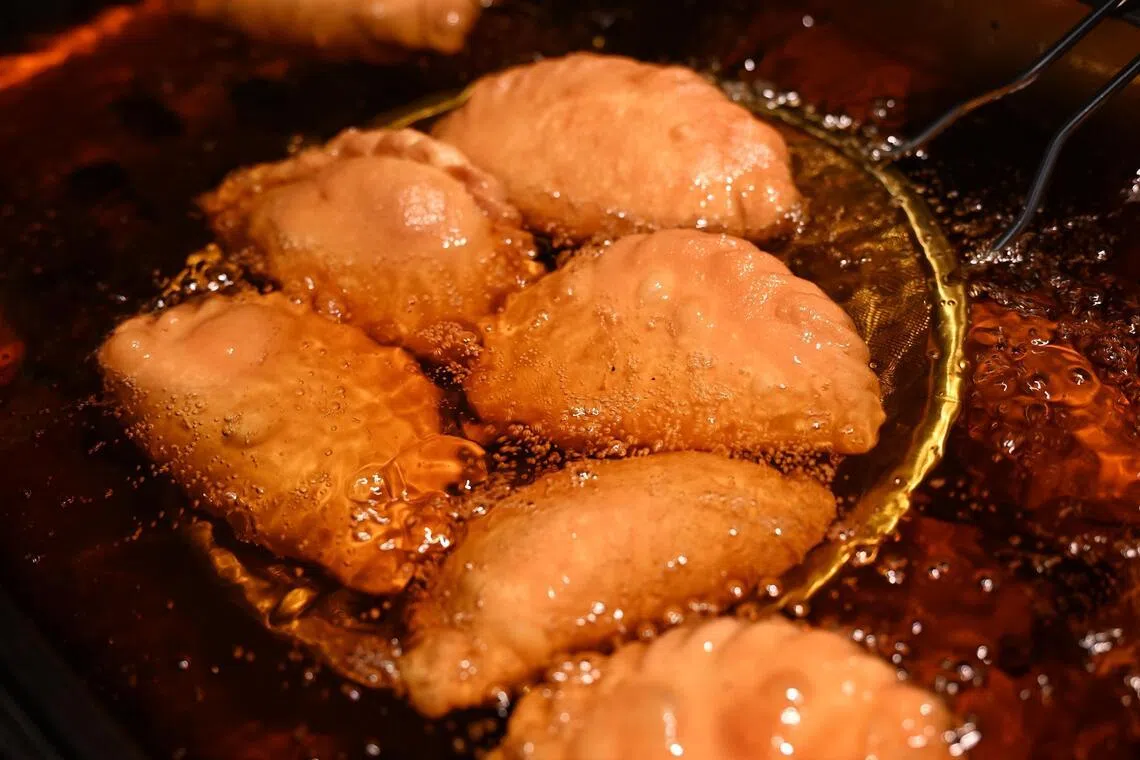 Curry puffs are fried onsite at every outlet. 