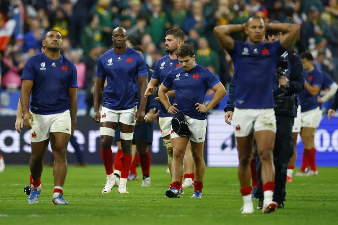 Rugby Union - Rugby World Cup 2023 - Quarter Final - France v South Africa - Stade de France, Saint-Denis, France - October 15, 2023 France's Antoine Dupont with teammates look dejected after the match REUTERS/Sarah Meyssonnier