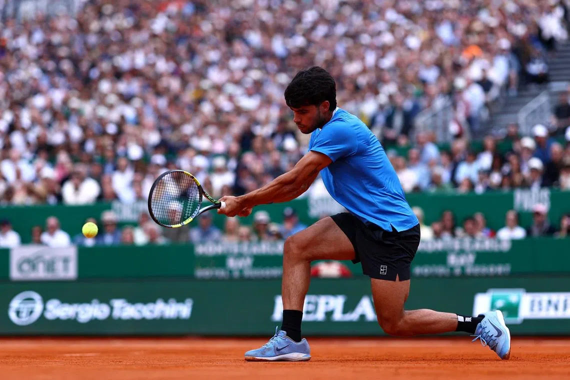 Tennis - ATP Masters 1000 - Monte Carlo Masters - Monte Carlo Country Club, Roquebrune-Cap-Martin, France - April 12, 2026 Spain's Carlos Alcaraz in action during his final match against Italy's Jannik Sinner REUTERS/Manon Cruz