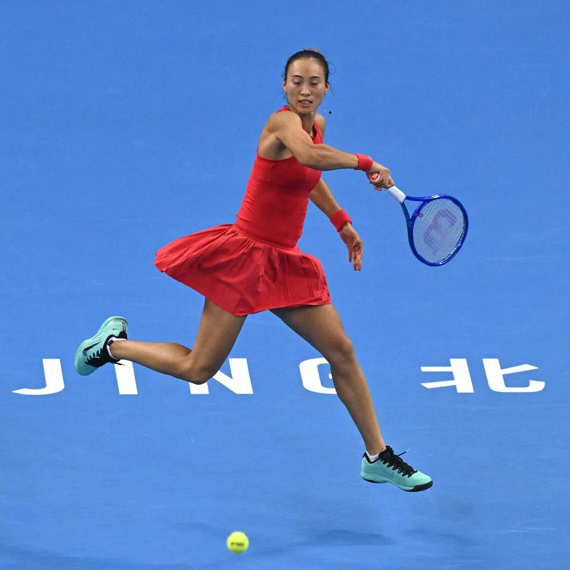 China’s Zheng Qinwen returning to Russia’s Mirra Andreeva during her 7-5, 6-4 win in their women’s singles final at the China Open in Beijing on Oct 11.
