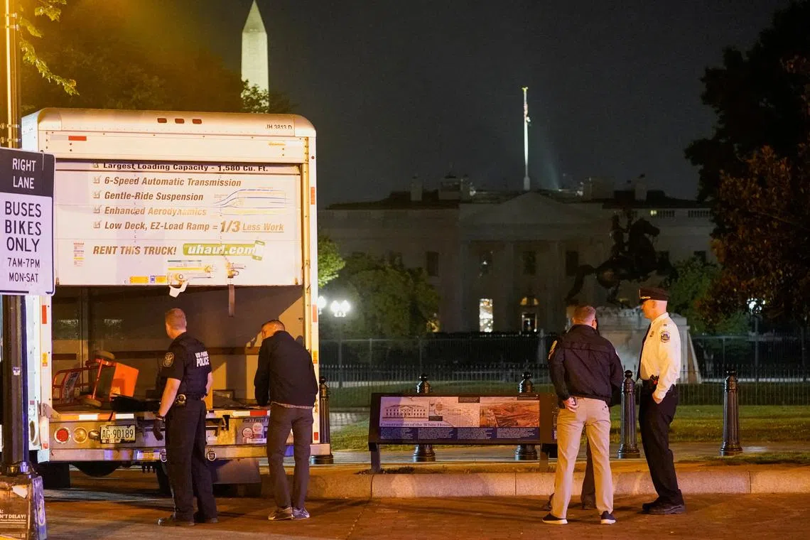 US law enforcement personnel investigating a rented box truck that crashed into security barriers at Lafayette Park, near the White House in Washington, on May 23, 2023.