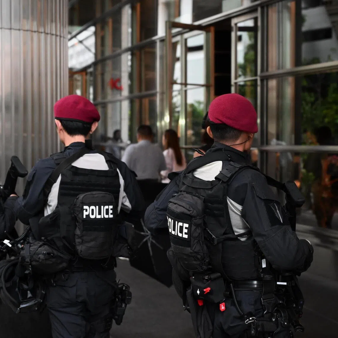 Police officers from the Special Operations Command (SOC) patrolling at the SGX Centre 1, along Shenton Way, on Sep 17, 2025.
