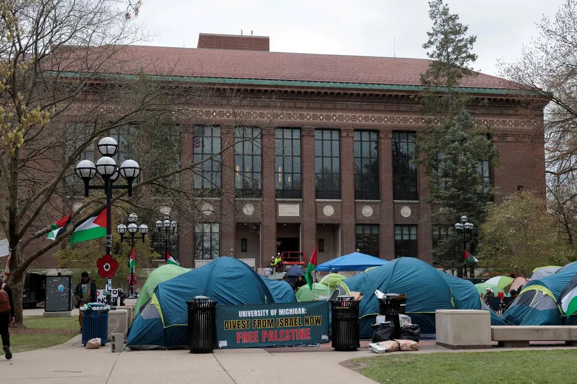 FILE PHOTO: A coalition of University of Michigan students camp in the Diag to pressure the university to divest its endowment from companies that support Israel or could profit from the ongoing conflict between Israel and the Palestinian Islamist group Hamas, on the University of Michigan college campus in Ann Arbor, Michigan, U.S., April 23, 2024. REUTERS/Rebecca Cook/File Photo