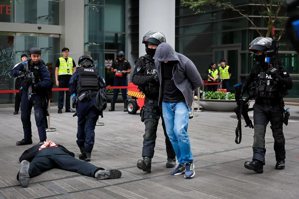 The Police Tactical Unit apprehend terrorists in a simulated attack at the counter-terrorism exercise Heartbeat at NUS Utown  on Feb 13, 2026.