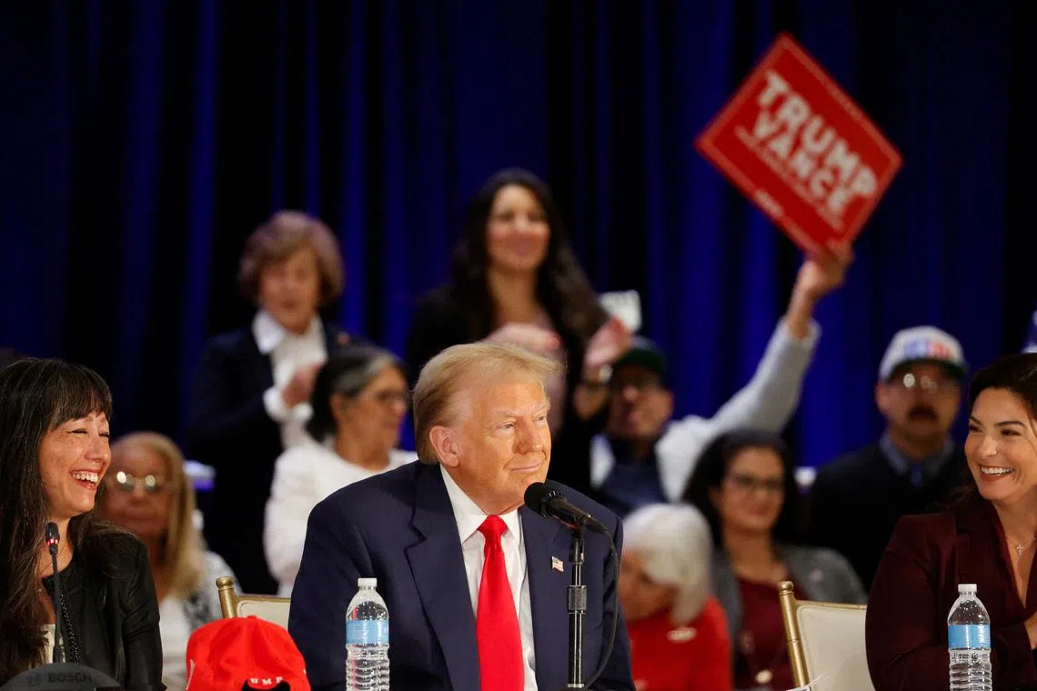 Republican presidential nominee and former U.S. President Donald Trump looks on during a roundtable discussion with Latino community leaders in Doral, Florida, U.S. October 22, 2024. REUTERS/Marco Bello