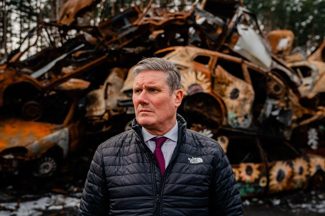 Labour Party leader Keir Starmer visits a cemetery of destroyed civilian cars in Irpin, near Kyiv, on Feb 16, 2023.