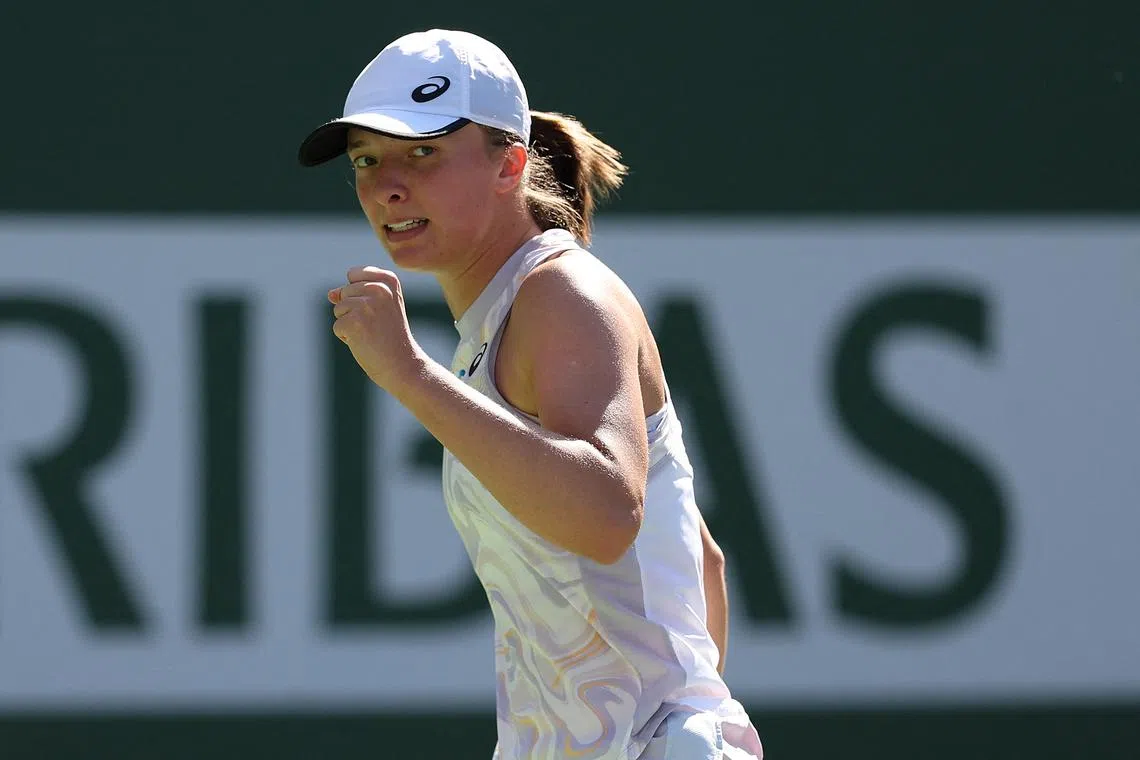 Iga Swiatek of Poland in celebrates defeating Sorana Cirstea of Romania, on March 16, 2023.