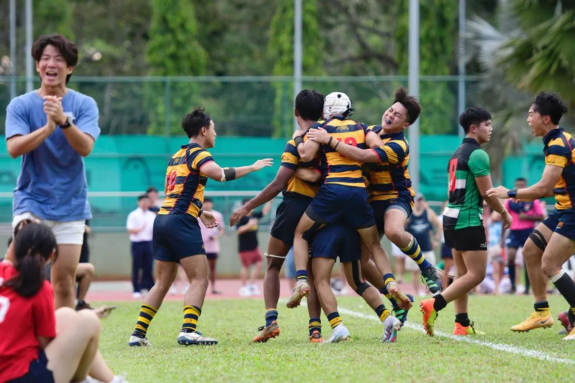 ACS(I) players celebrate after Jeremiah Williams scores a try to give the school a 13-9 lead against RI. ACS (Independent) was crowned champions at the National School Games Rugby 'A' Division Cup final between Anglo-Chinese School (Independent) vs Raffles Institution on May 15, 2023 at MOE Evans stadium. 