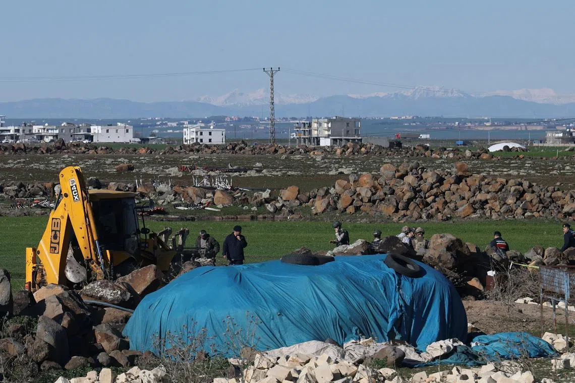 FILE PHOTO: Turkish army personnel search a field after a piece of ammunition fell following the interception of a missile launched from Iran by a NATO air defence system, in Diyarbakir, Turkey, March 9, 2026. REUTERS/Sertac Kayar/File Photo