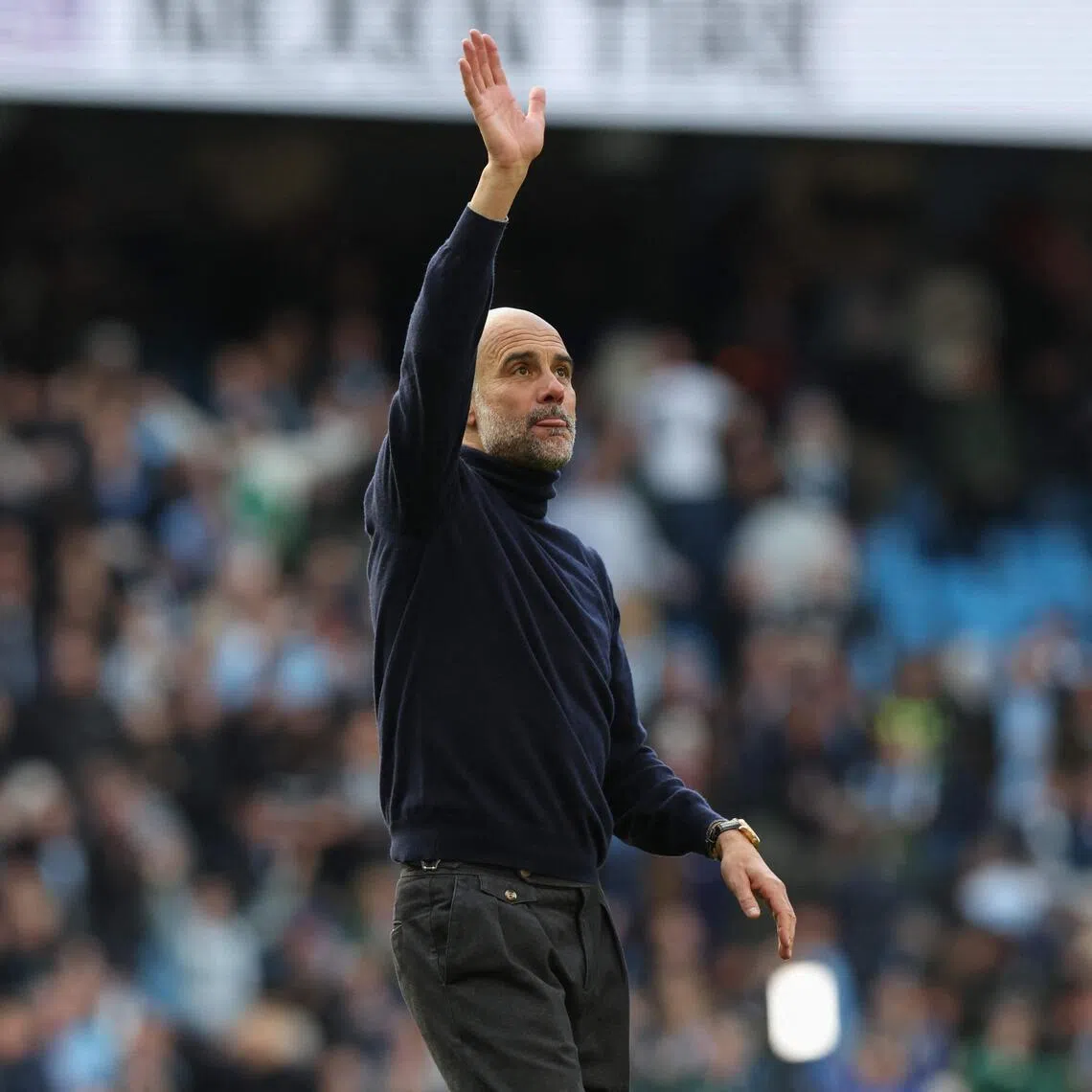 Manchester City manager Pep Guardiola celebrates after the 2-1 Premier League win over Arsenal.