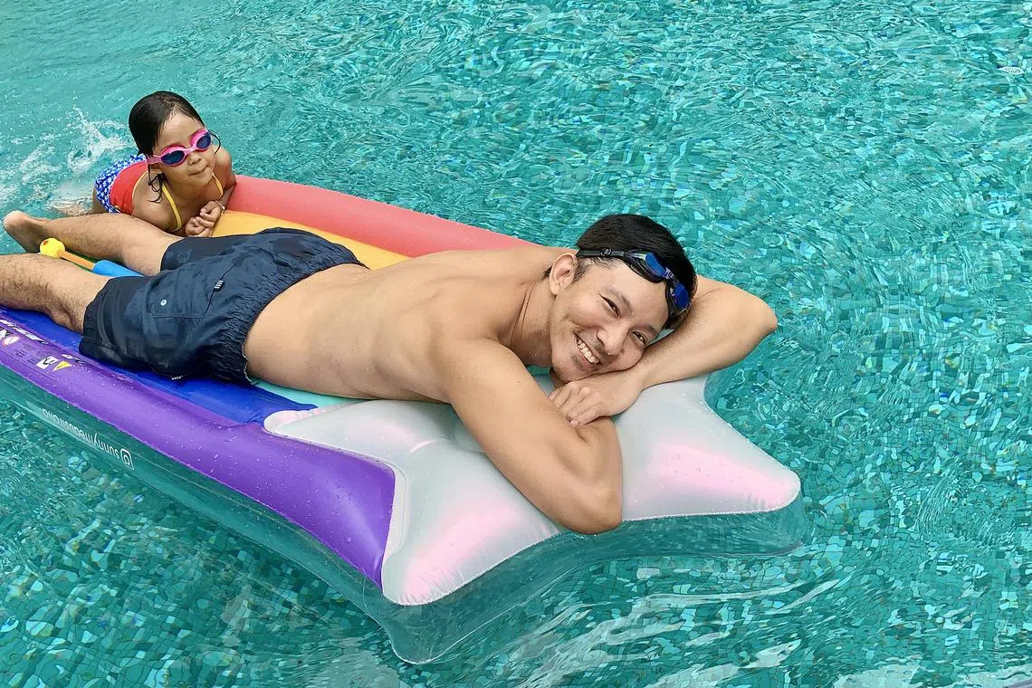 Singaporean Leon Jay Williams, seen here with his daughter, Harper, spends time at the pool and beach.