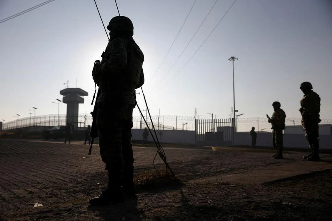 FILE PHOTO: Soldiers stand outside the Altiplano high security prison where Mexican drug gang leader Ovidio Guzman, the 32-year-old son of jailed kingpin Joaquin \"El Chapo\" Guzman, is imprisoned in Almoloya de Juarez, State of Mexico, Mexico January 7, 2023. REUTERS/Luis Cortes/File Photo